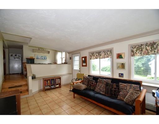 33 Wyola Road Hull, MA 02045 - Photo 9 of 16 a living room with furniture and a fireplace
