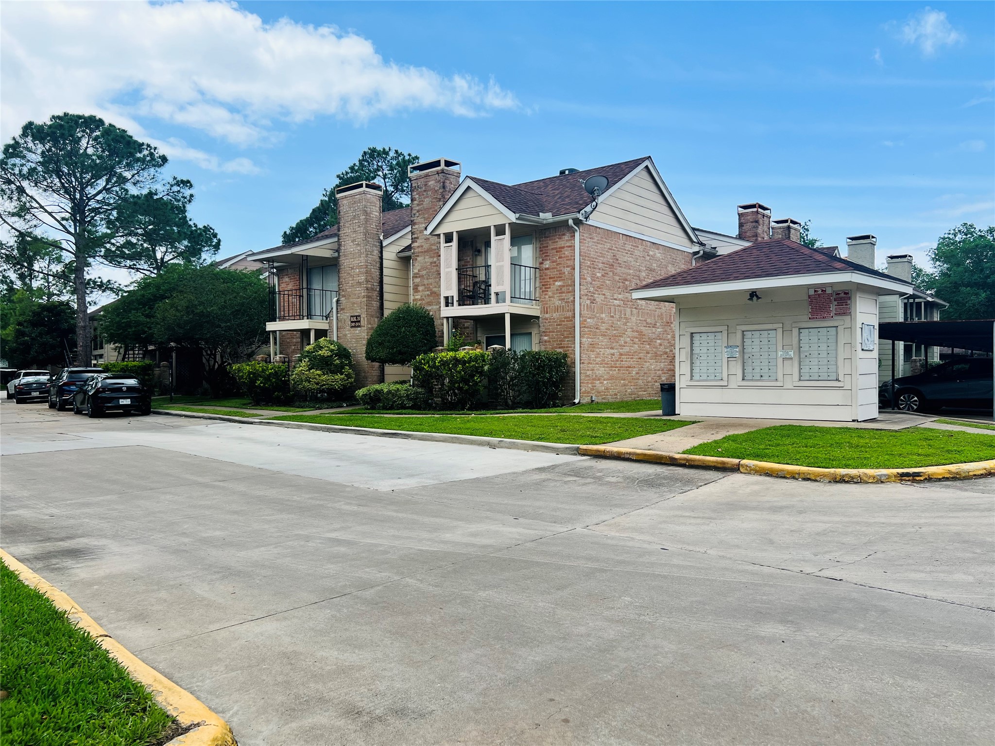 2800 Jeanetta Street, Unit 1702 Houston, TX 77063 - Photo 16 of 23 a view of a white house with a big yard and large trees