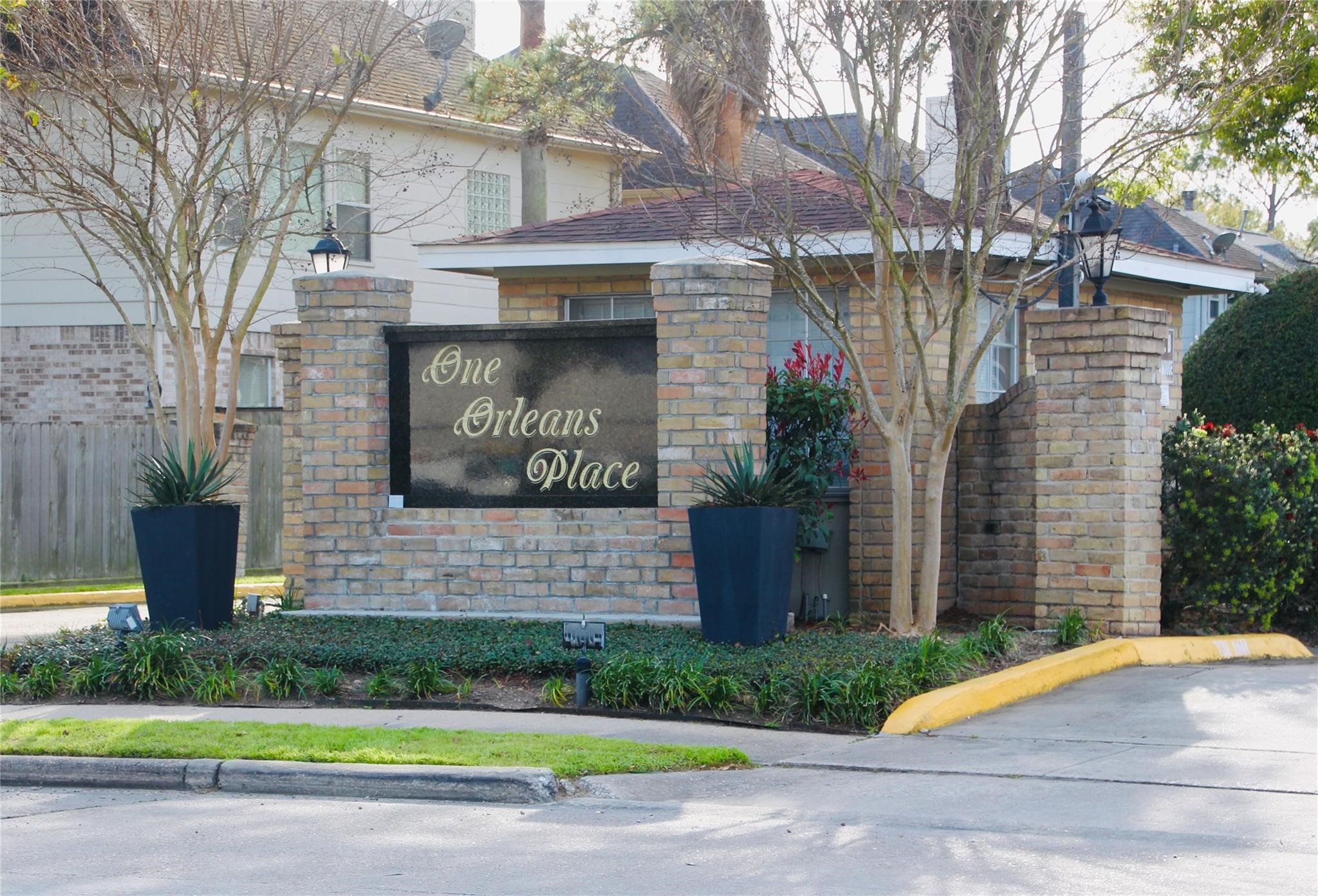 2800 Jeanetta Street, Unit 1702 Houston, TX 77063 - Photo 23 of 23 a front view of a house with a garden and plants