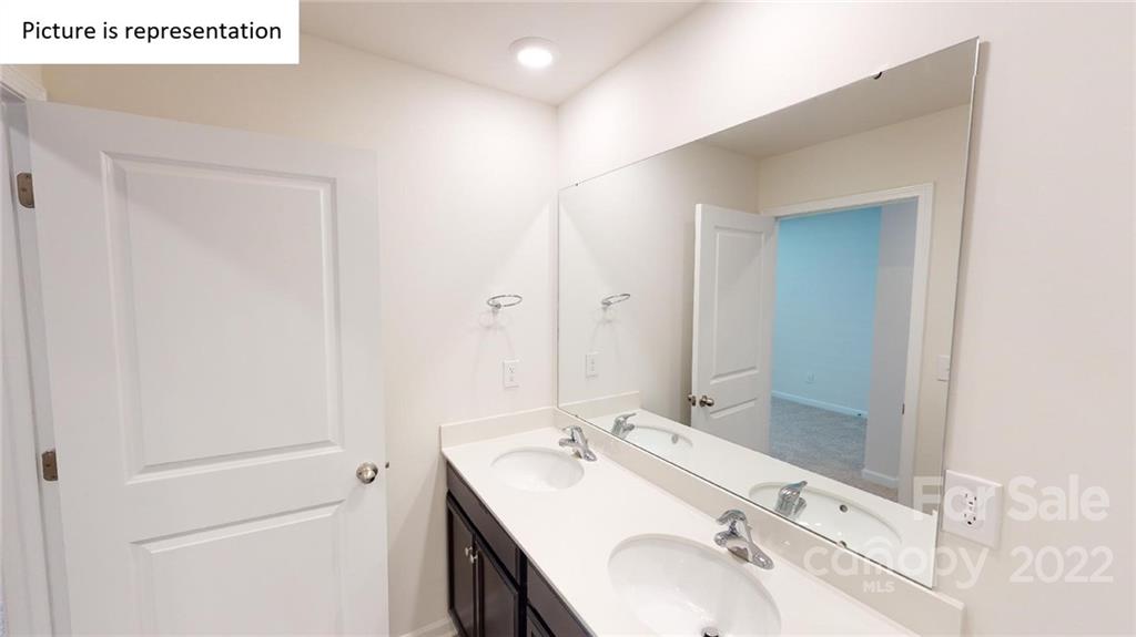 5026 Fandango Road York, SC 29745 - Photo 18 of 26 a bathroom with a sink and a mirror