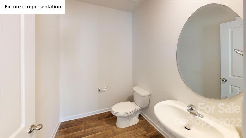 5026 Fandango Road York, SC 29745 - Photo 19 of 26 a bathroom with a toilet sink and mirror