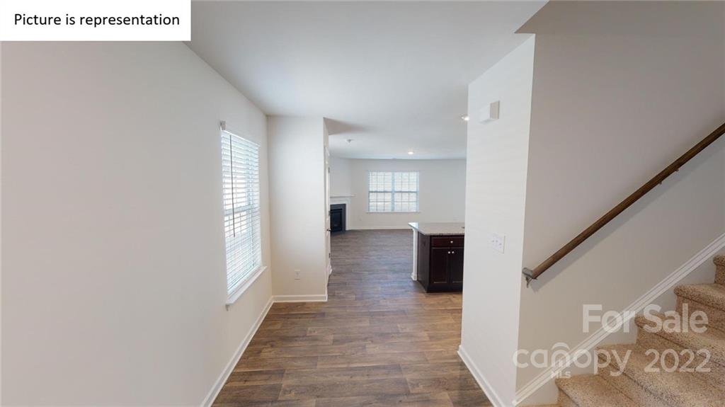 5026 Fandango Road York, SC 29745 - Photo 2 of 26 a view of a hallway with wooden floor and staircase