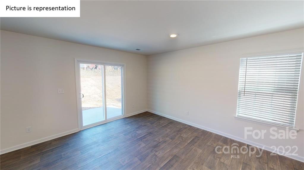 5026 Fandango Road York, SC 29745 - Photo 21 of 26 an empty room with wooden floor and windows