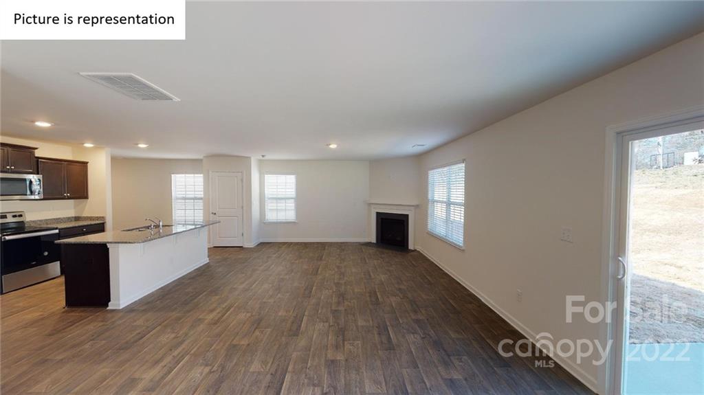 5026 Fandango Road York, SC 29745 - Photo 22 of 26 a view of kitchen with sink refrigerator and wooden floor