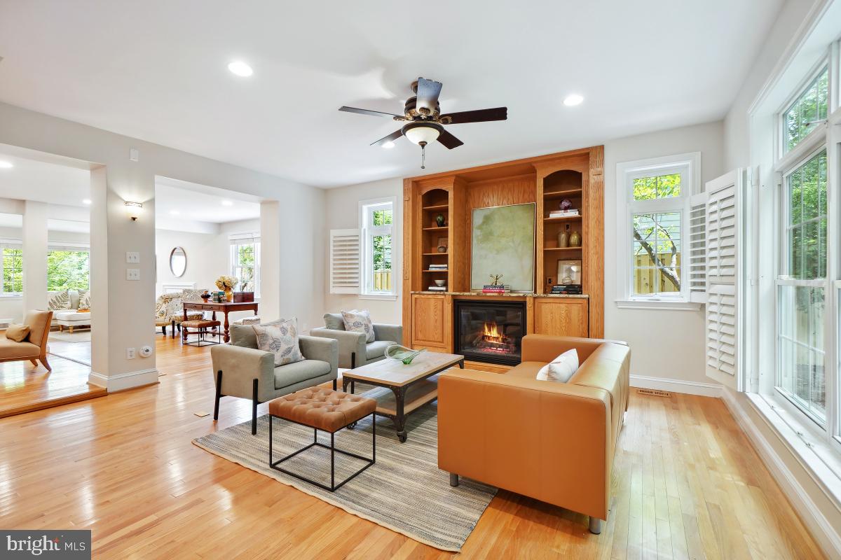 8610 Melwood Road Bethesda, MD 20817 - Photo 11 of 44 a living room with fireplace furniture and a large window