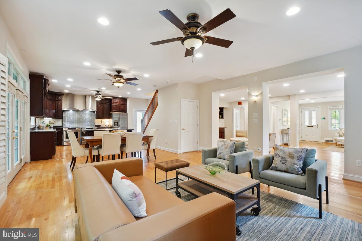 8610 Melwood Road Bethesda, MD 20817 - Photo 12 of 44 a living room with furniture kitchen view and a chandelier