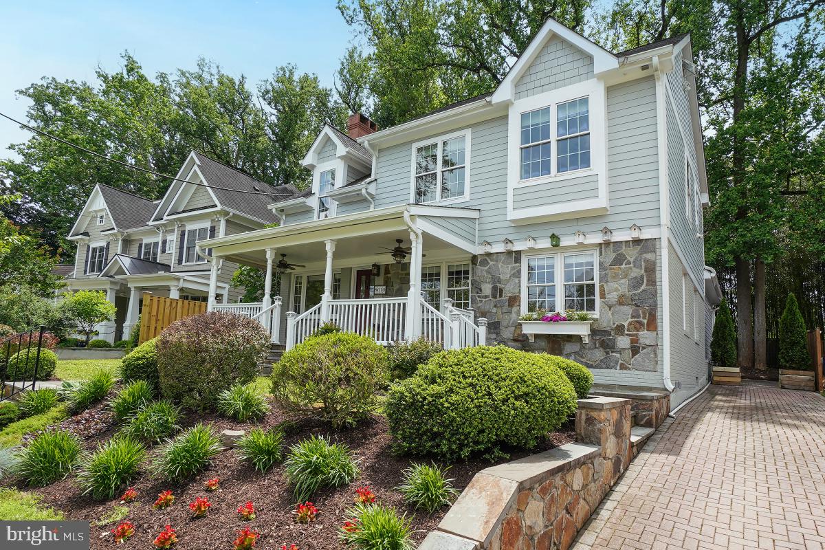 8610 Melwood Road Bethesda, MD 20817 - Photo 2 of 44 a front view of a house with garden
