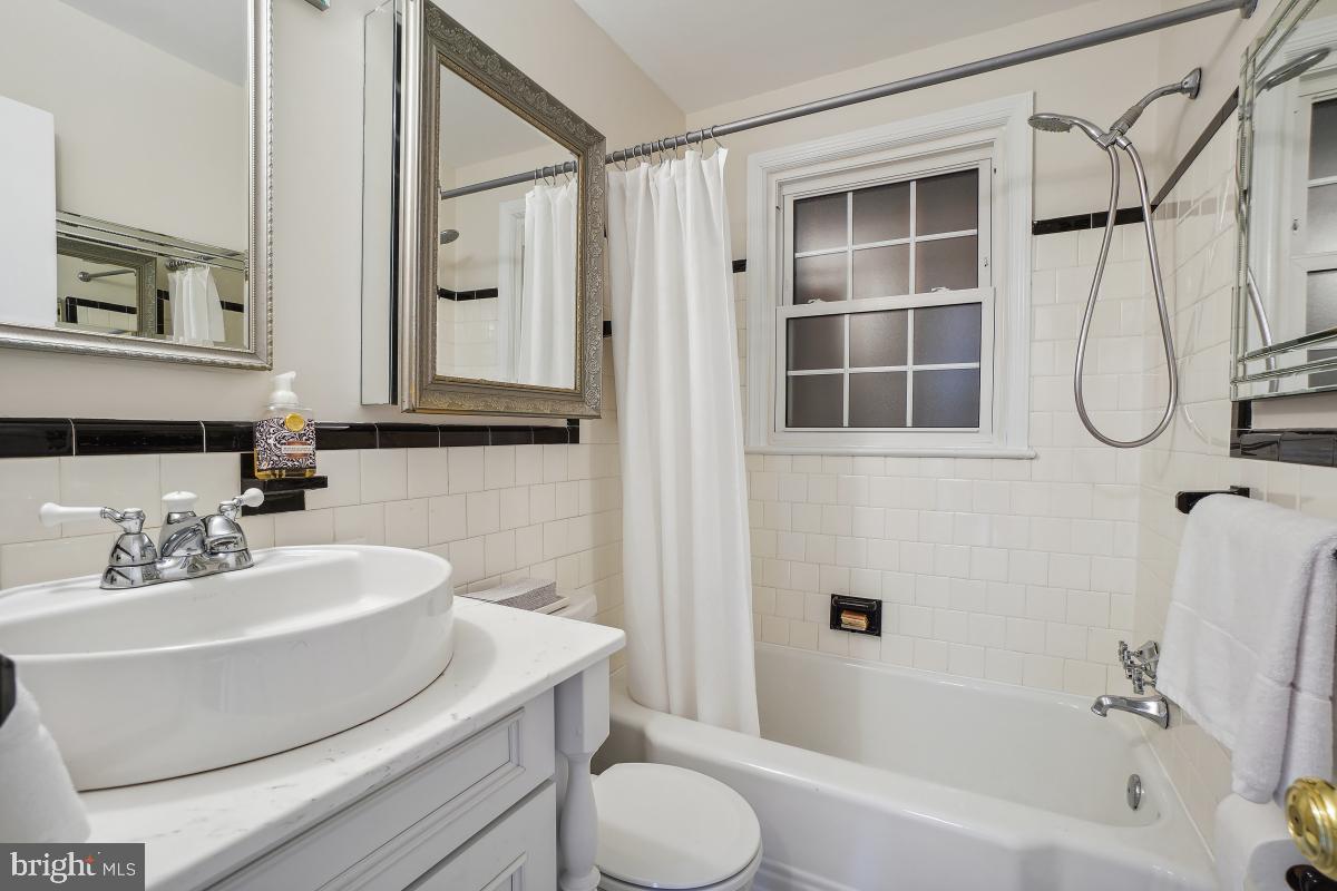8610 Melwood Road Bethesda, MD 20817 - Photo 23 of 44 a bathroom with a sink toilet and shower