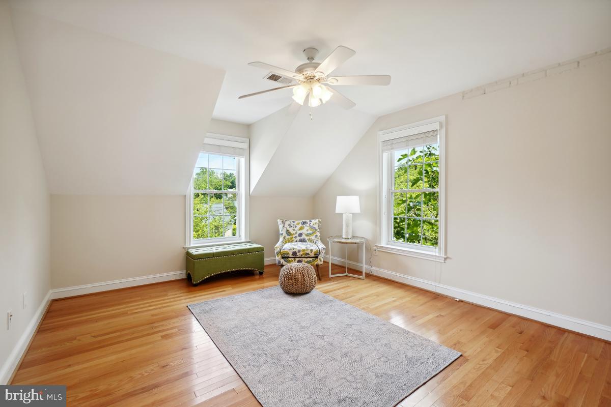 8610 Melwood Road Bethesda, MD 20817 - Photo 32 of 44 a living room with furniture and a chandelier