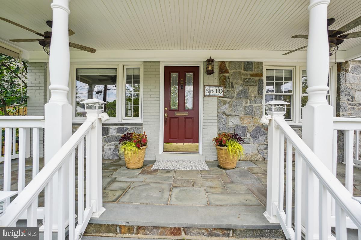 8610 Melwood Road Bethesda, MD 20817 - Photo 4 of 44 a view of an entryway with dining room and furniture