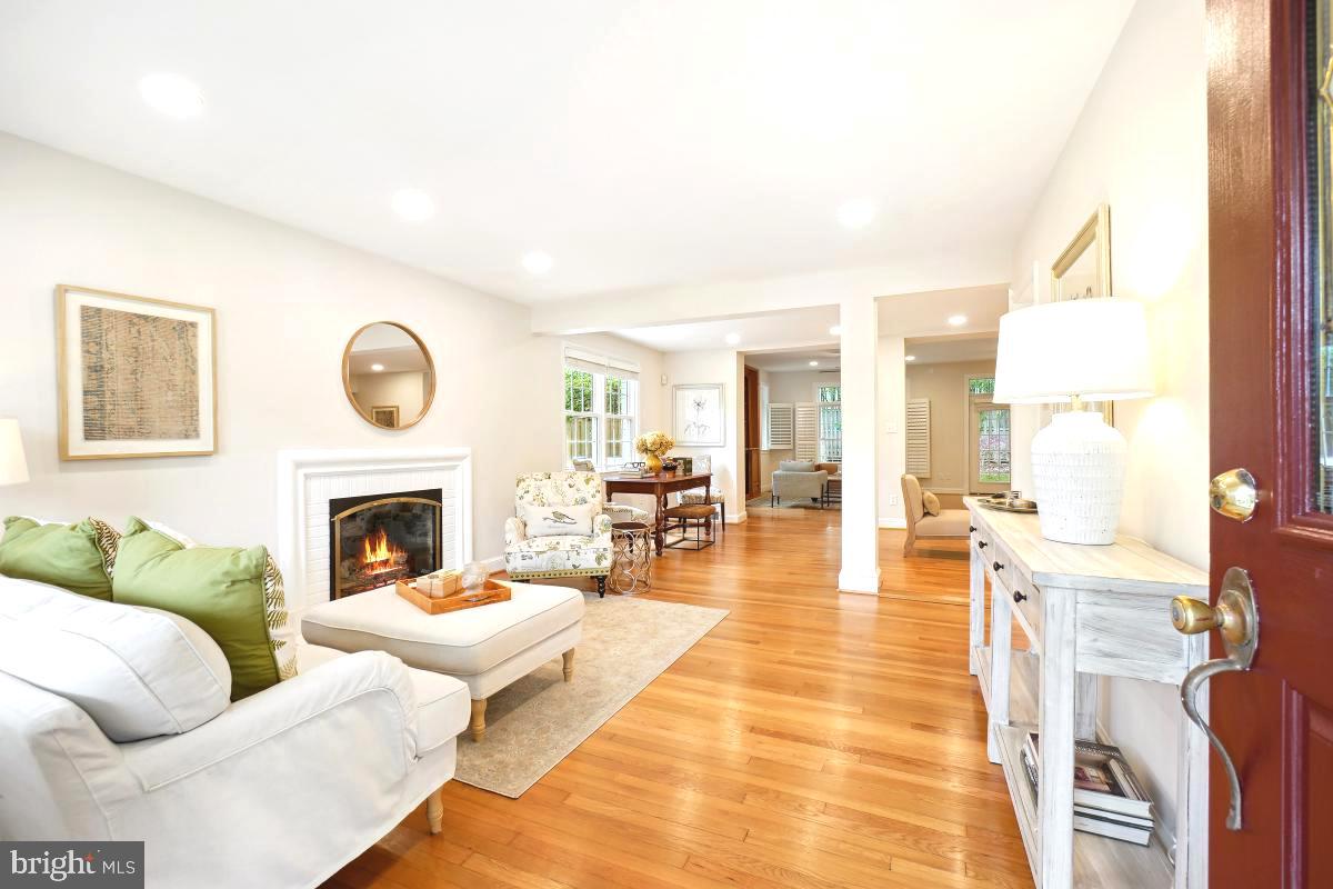 8610 Melwood Road Bethesda, MD 20817 - Photo 5 of 44 a living room with furniture and a fireplace
