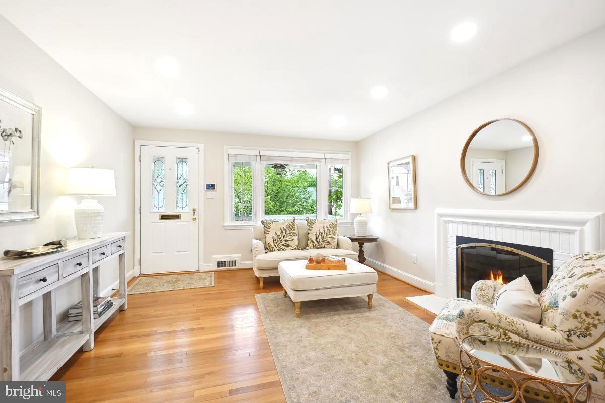 8610 Melwood Road Bethesda, MD 20817 - Photo 6 of 44 a living room with furniture and a fireplace