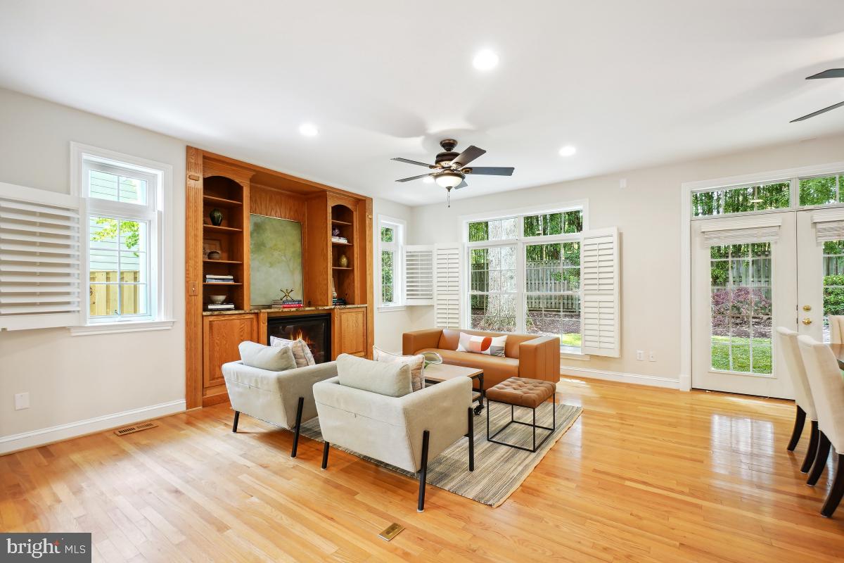 8610 Melwood Road Bethesda, MD 20817 - Photo 10 of 44 a living room with furniture and large windows