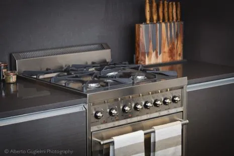 a kitchen with a stove and a cabinet