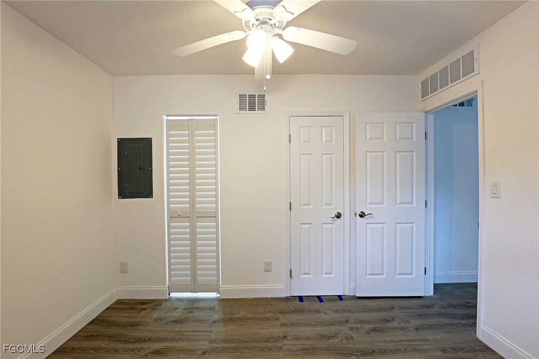 2590 First Street, Unit 105 Fort Myers, FL 33901 - Photo 9 of 13 a view of a livingroom with wooden floor