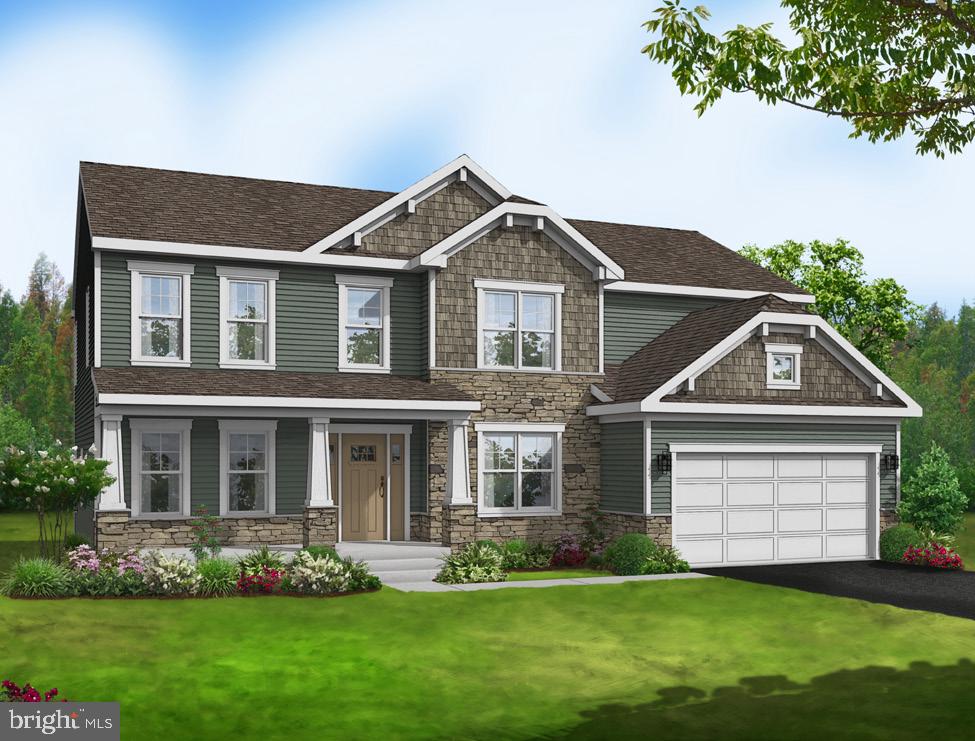 16107 Trinity Way King George, VA 22485 - Photo 2 of 2 a front view of a house with a garden and yard