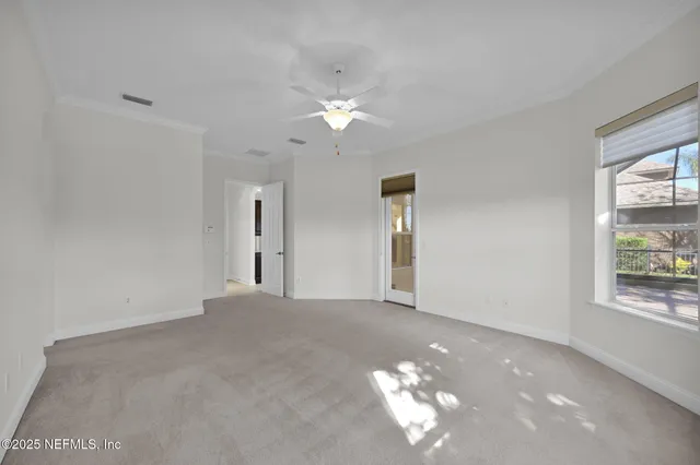 a view of entryway with wooden floor and a front door