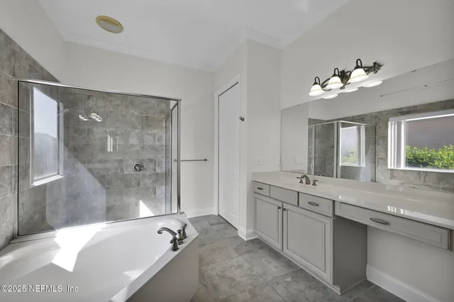 an empty room with a window and a ceiling fan