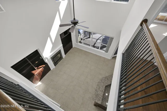 a view of a swimming pool with a bench and tables