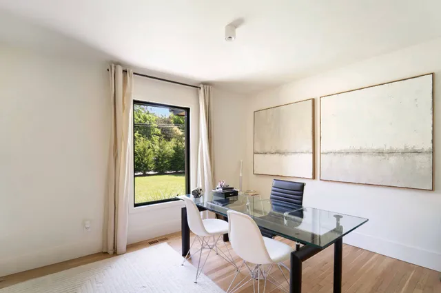 a workspace with furniture and a window