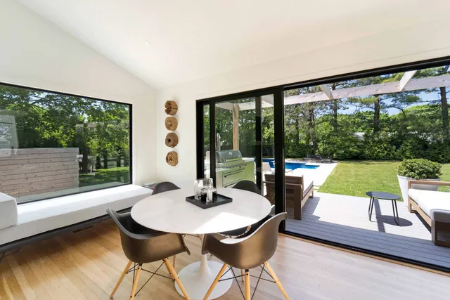a view of a dining room with furniture window and outside view