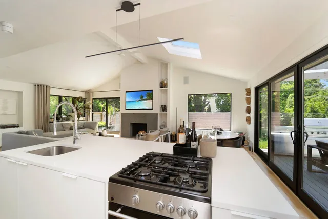 a kitchen with stove and refrigerator