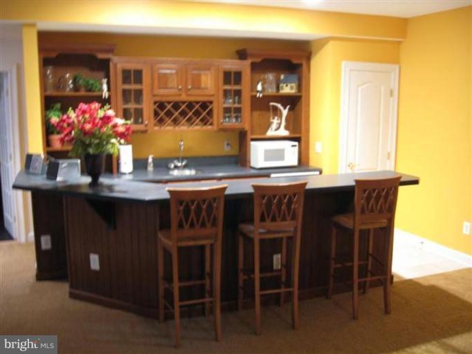3011 Hunt Road Oakton, VA 22124 - Photo 27 of 30 Wet Bar with Fridge in Recreation Room