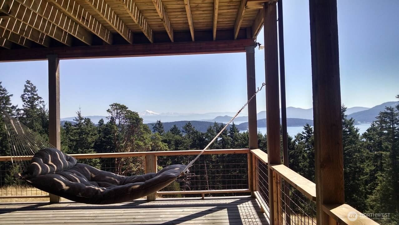 726 Pine Ridge Drive Orcas Island, WA 98280 - Photo 35 of 40 a view of balcony with two chairs and wooden fence