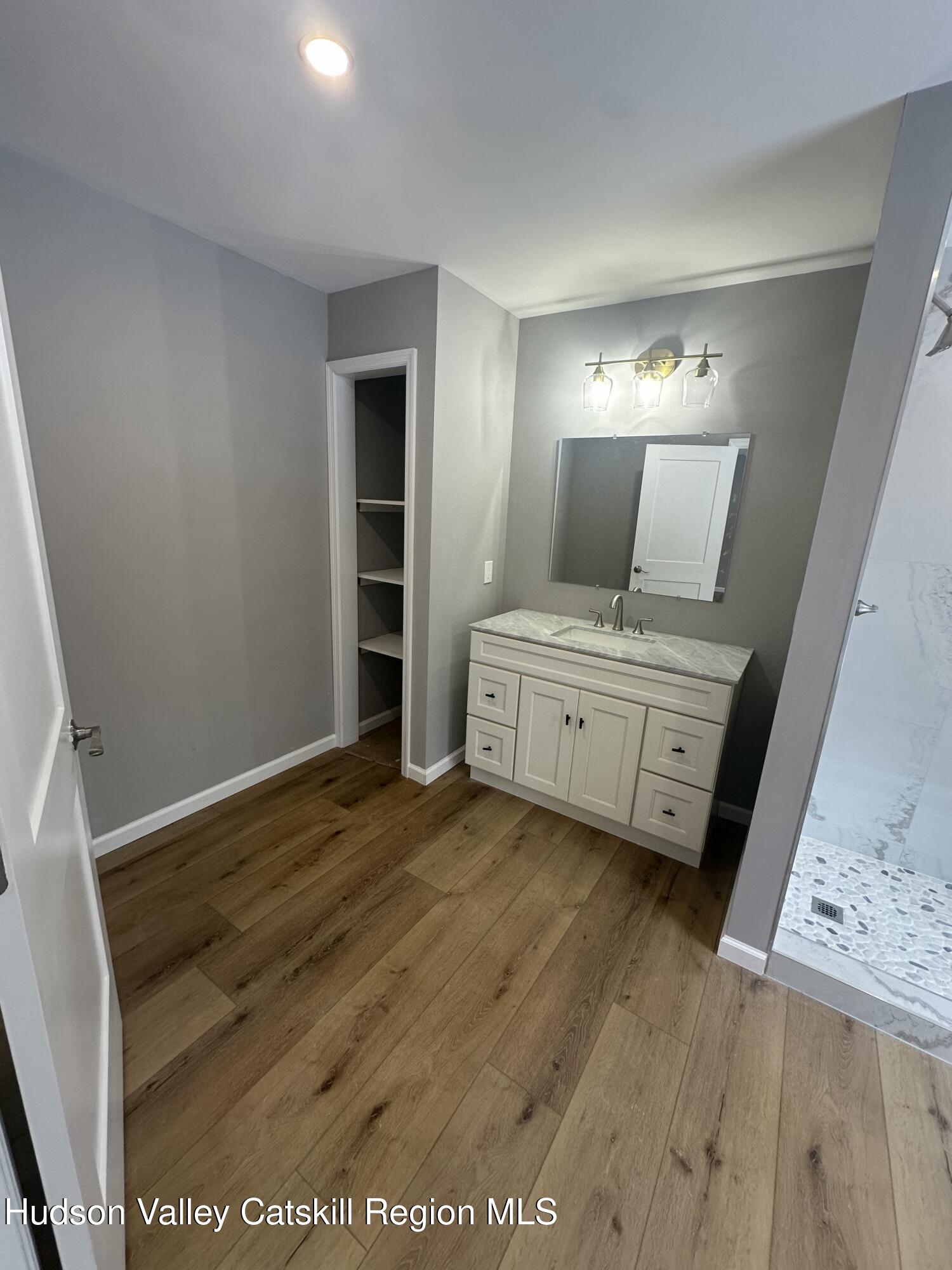 20 Olivers Way Cairo, NY 12413 - Photo 19 of 20 a view of a room with wooden floor cabinet and mirror