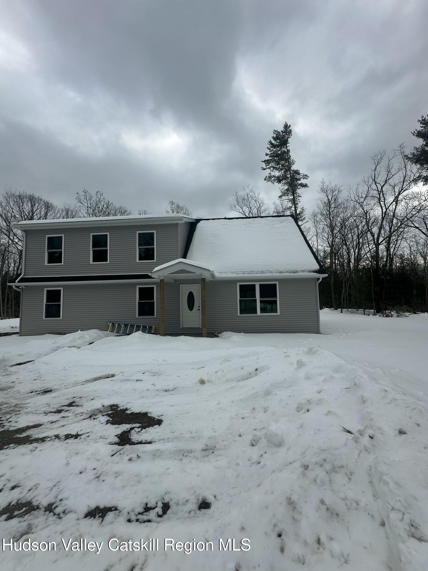 20 Olivers Way Cairo, NY 12413 - Photo 2 of 20 a front view of a house with a yard