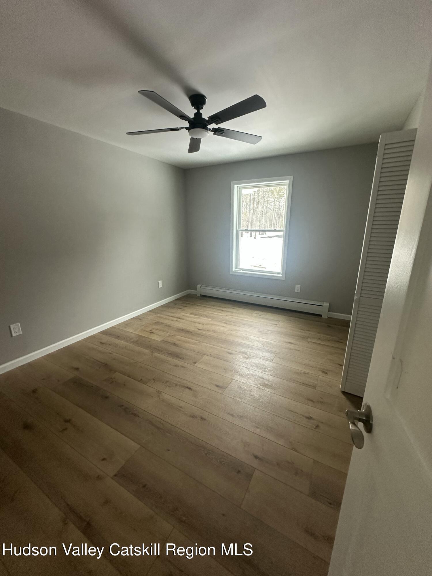 20 Olivers Way Cairo, NY 12413 - Photo 9 of 20 wooden floor in an empty room