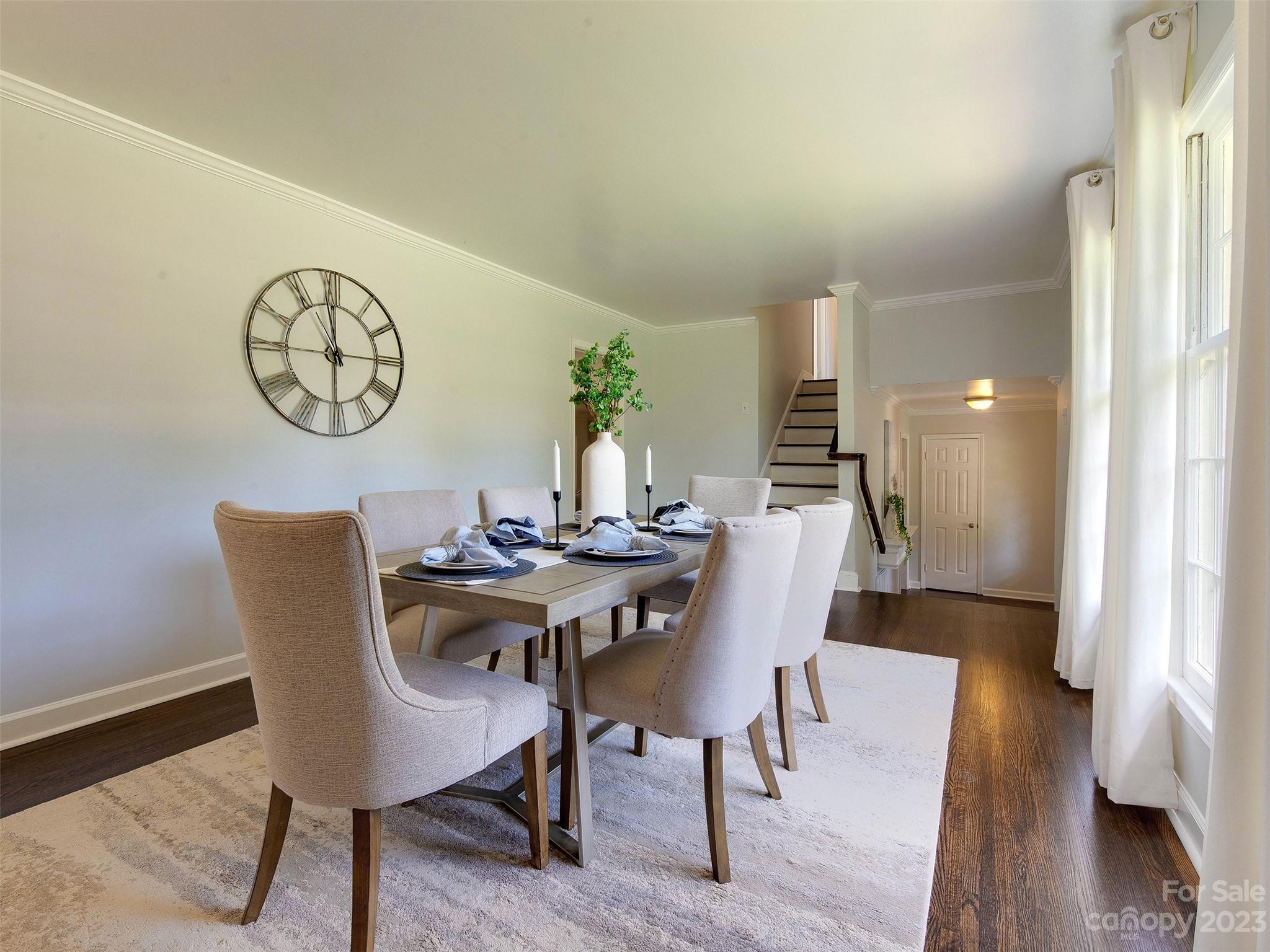 2916 Goneaway Road Charlotte, NC 28210 - Photo 28 of 48 a view of a dining room with furniture and wooden floor
