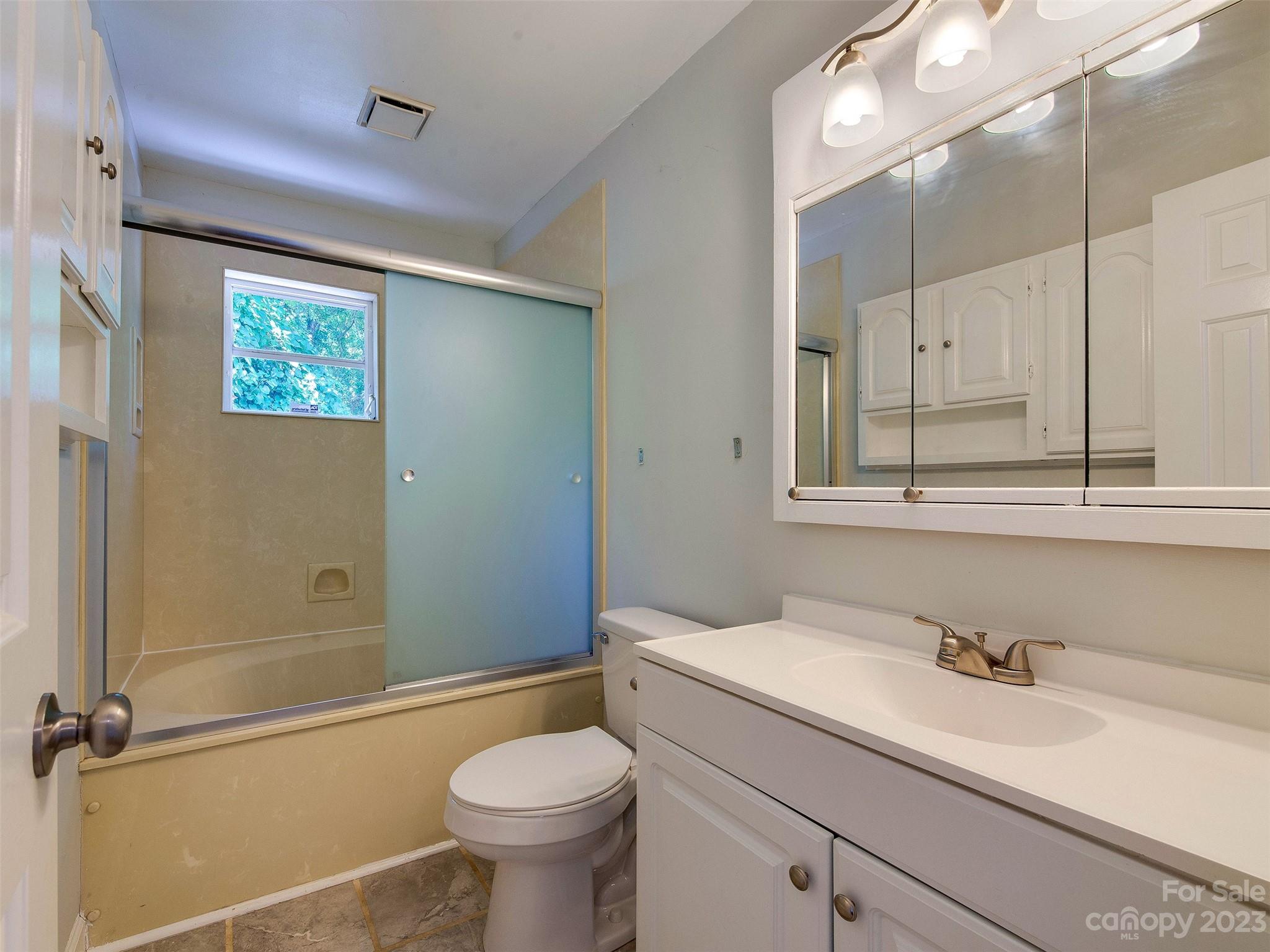 2916 Goneaway Road Charlotte, NC 28210 - Photo 41 of 48 a bathroom with a sink and a mirror