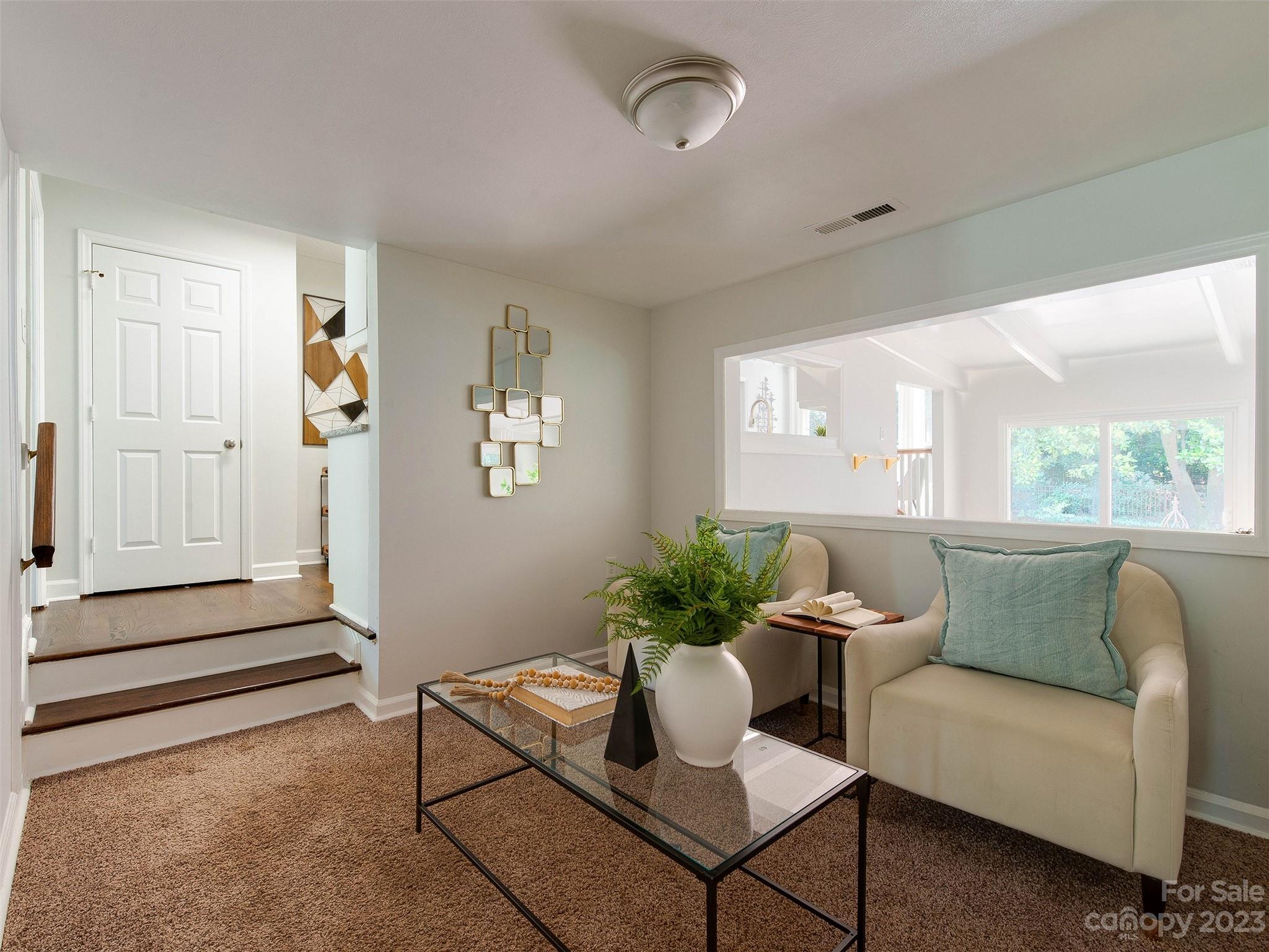 2916 Goneaway Road Charlotte, NC 28210 - Photo 6 of 48 a living room with furniture and wooden floor