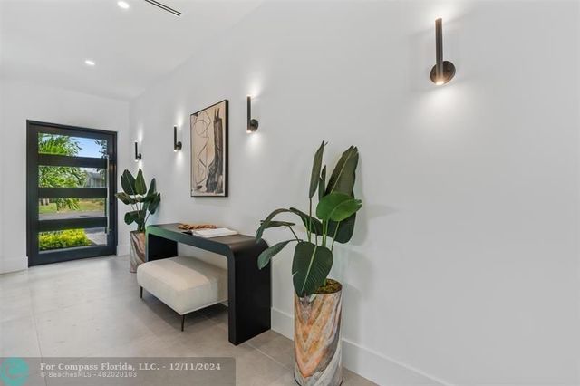 a bathroom with a shower and a sink
