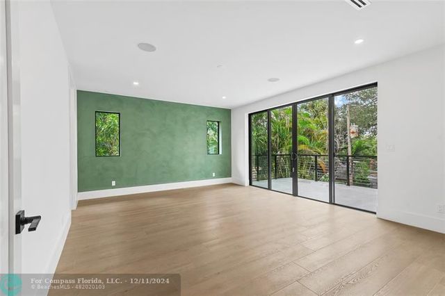 a bathroom with a sink mirror and vanity
