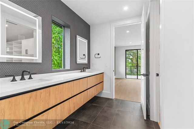 a view of house with swimming pool outdoor seating