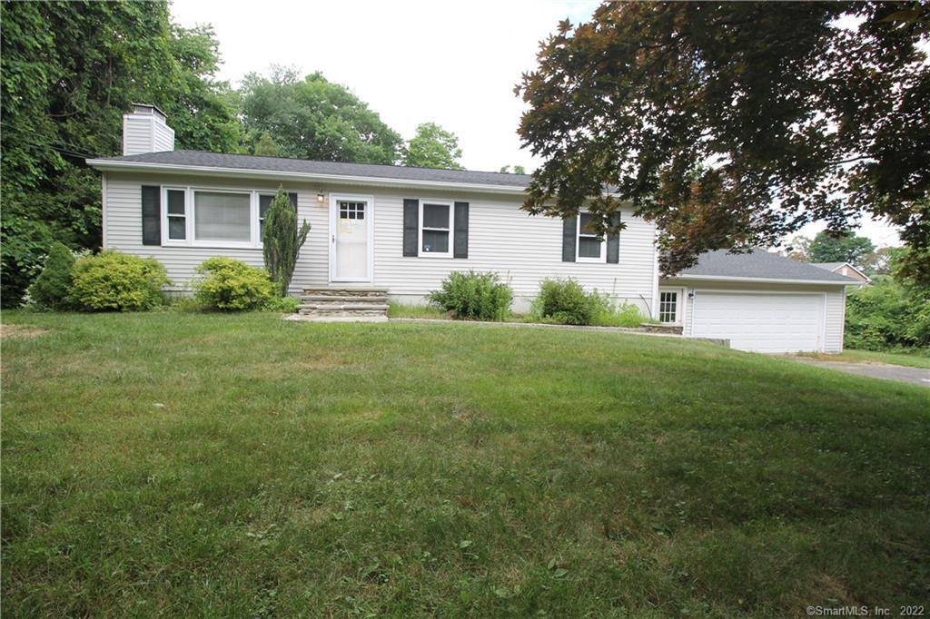 15 Dana Road Danbury, CT 06811 - Photo 1 of 1 a front view of house with yard and green space