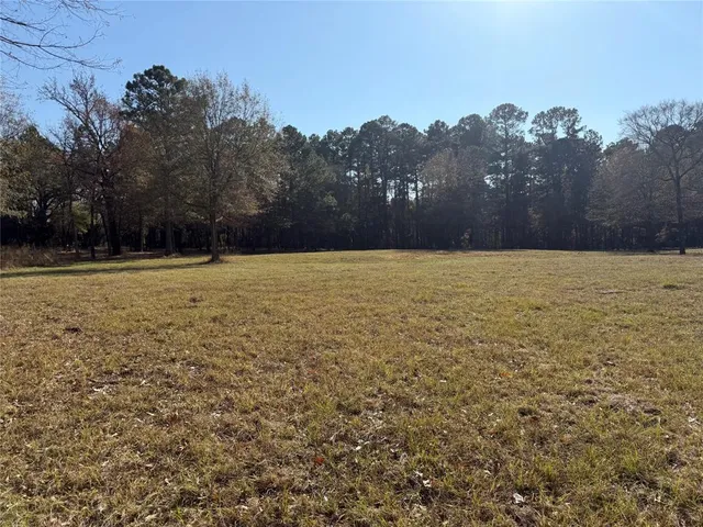 a view of open space with a lake view