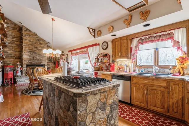a view of a dining room with furniture and chandelier