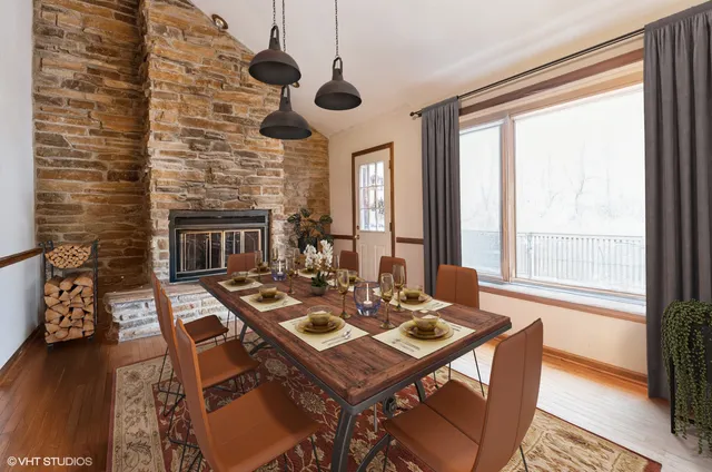 a view of entryway with wooden floor and windows