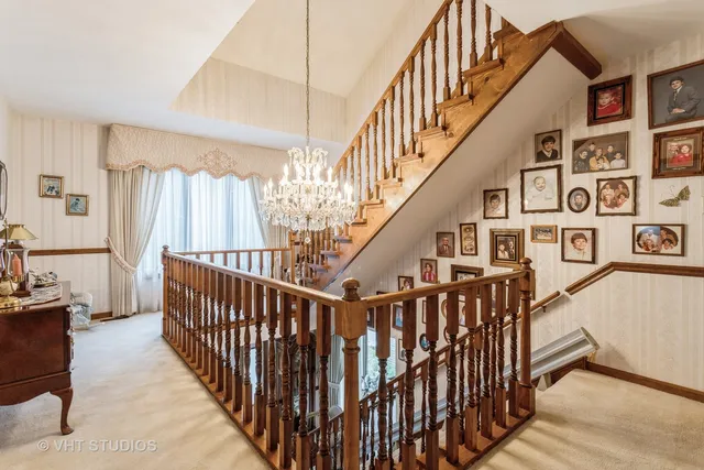 a view of staircase with railing and stairs