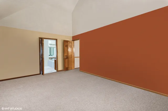 a bedroom with bed and painting on the wall