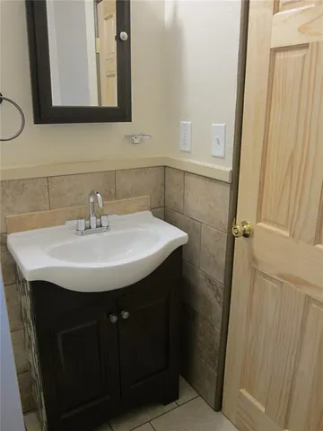 a kitchen with a sink and a stove top oven