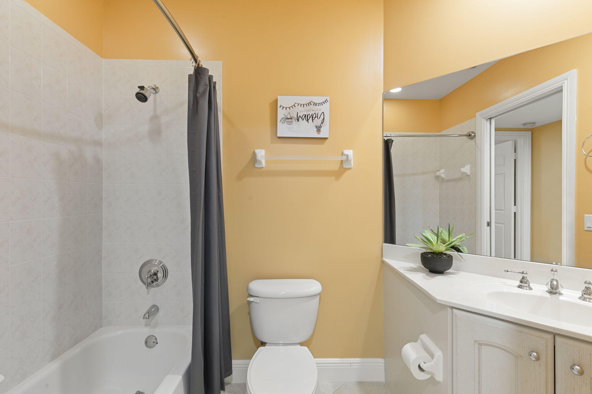 9066 Cascada Way, Unit 101 Naples, FL 34114 - Photo 24 of 51 a bathroom with a toilet a sink and a bathtub