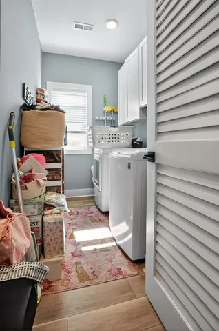 a balcony with furniture and a floor to ceiling window