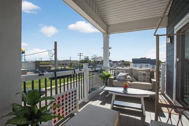 a outdoor space with patio the couches and iron fence