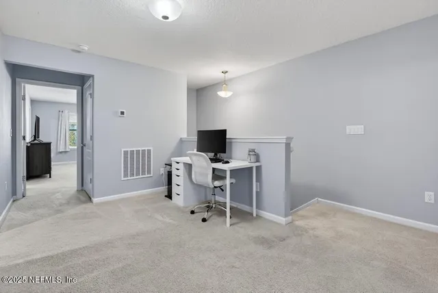 a view of a room with racks on the wall