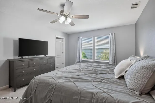 a bed room with a bed and a night stand