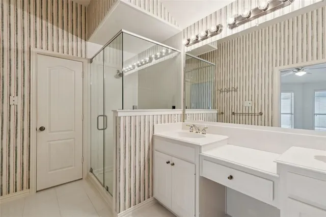 a bathroom with a sink and mirror